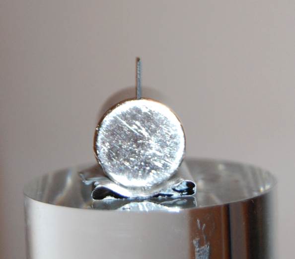 Below: Pyrolytic graphite easily balanced along its edge in line with the divergent centrifugal magnetism to which the diamagnetic pyrolytic graphite is repulsed due to high order dielectric inertia within the carbon cry