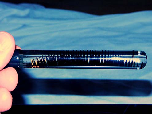 BELOW: One of my own inventions of a ferrofluid suspension on the left with wholly unique properties and interesting attributes. On right is conventional ferrofluid suspension as found immersed in sugar-saturated (or oth