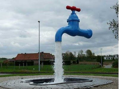 Below: The “magic faucet amusement”. Water is being pumped from an unseen pump in the pool up through a clear tube to just inside the faucet and allowed to pour out around the tube via gravity. What is driving magnetism 