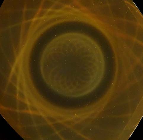 Below: Two pieces of a broken ring magnet on the left, on the right is a 1.5” ring magnet showing the pair of centripetal/ centrifugal hypotrochoid patterns of light as directed by the divergent and convergent magnetism.