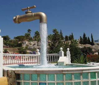 Below: The “magic faucet amusement”. Water is being pumped from an unseen pump in the pool up through a clear tube to just inside the faucet and allowed to pour out around the tube via gravity. What is driving magnetism 