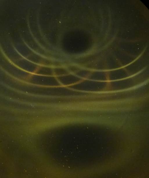 Below: Notice distorted pole on image both left and right as created by image in center of a ½ cylinder magnet stuck in the center of a much larger ceramic ring magnet. All field pressures mediate themselves as necessita