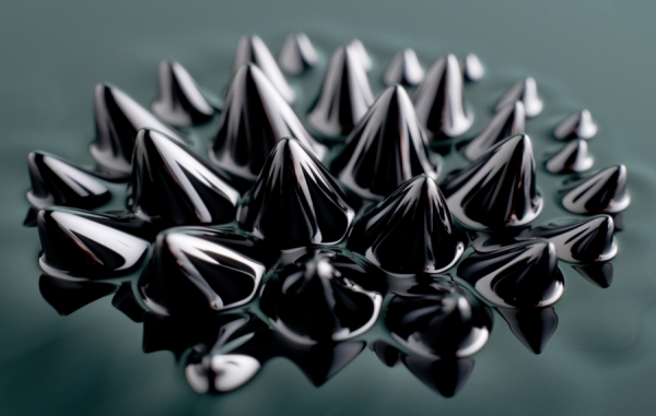 BELOW: Left is a special formulation of ferrofluid immersion, which shows the centripetal vortex of the magnet below it. On the right is standard ferrofluid as explained for the first time ever here.