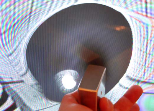 Below: Alternating rings of cloudy light and dark as necessitated by dielectric displacement from the centrifugal magnetism as against the CRT.