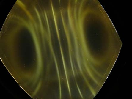 Below: Cube magnet under ferrocell. Polarity is left to right on left image, and top to bottom on right image. Notice the brighter yellow light along the inertial plane of the magnet.
