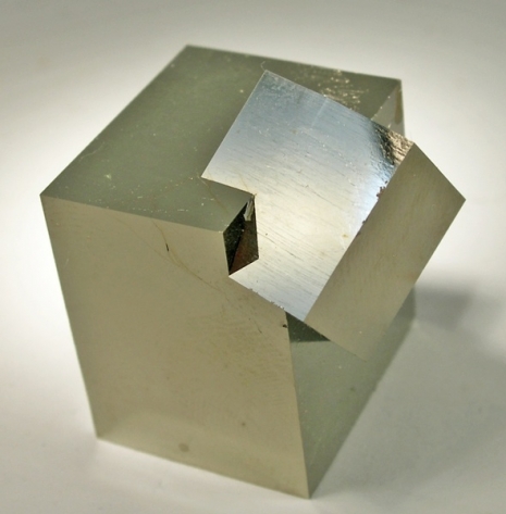 Below: On the left, a perfect example of intersecting spatially polarized iron cubes superimposing in growth upon one another. On the right a partial though near-perfect example of a counterspatial dielectric ‘anti-cube’