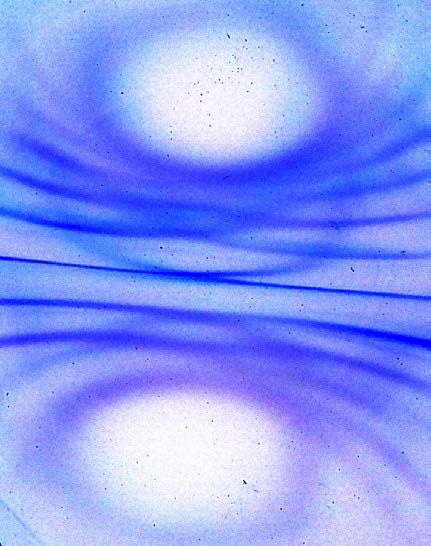 Below: Inverted real magnetism image I created of a 1.25” ring magnet on left, top down, thru a ferrocell, likewise on right, a 1” cube neodymium magnet seen edge on along the dielectric inertial plane, with, top and bot