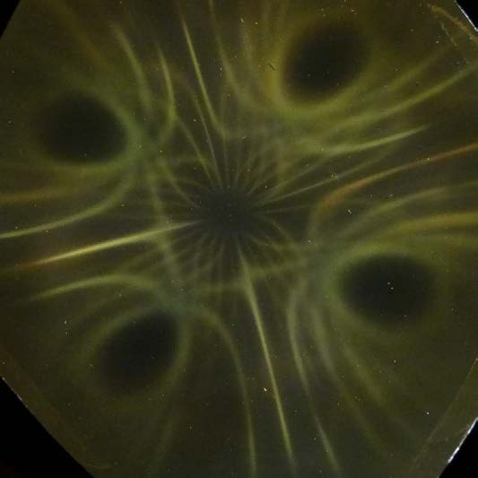 Below: Image on left, two cylinder magnets on the right connected along their non-polarized sides. Image on right broken ring magnet.