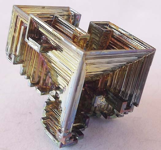 Below: On the left, a perfect example of intersecting spatially polarized iron cubes superimposing in growth upon one another. On the right a partial though near-perfect example of a counterspatial dielectric ‘anti-cube’