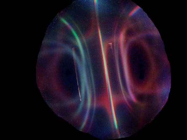Below: As predicted and discovered by myself there is white light along the dielectric inertial plane of a N50 1” cube neodymium (any magnet as a matter of fact) and red and green light along the poles due their lower di