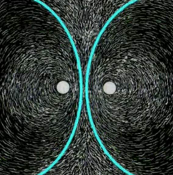 Iron-filings pattern around two circular magnet poles, overlaid with cyan opposing curves.