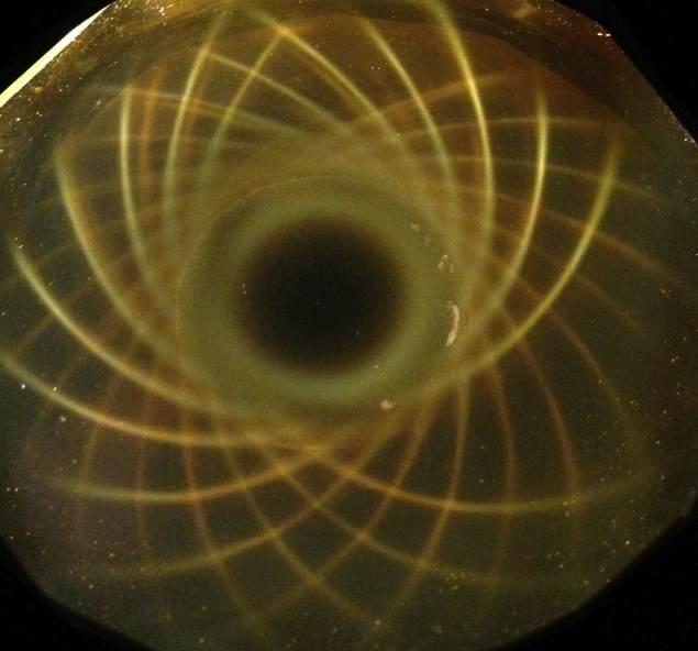 Below: Deep view on left of a cube magnet, illustrated is the dielectric inertial plane in yellow and the hyperbolic bowl shaped depression of centrifugal magnetism as mediated against the opposite-side-returning centrip