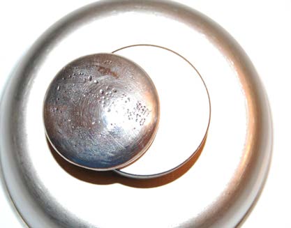 Below: Bismuth disk’s final resting place, perpetually ending at the same spread leaving the same golden ratio attraction (voidance) and countervoidance (repulsion) position along the 2”x1” cylinder neodymium. This harmo