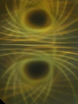 Below: Three images of cube 1” magnets under the ferrocell. Notice the bright white light along the inertial plane on the images, especially on the far right.