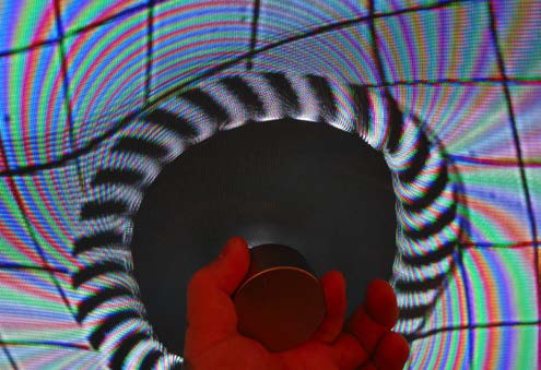 Below: Both images below are the exact same clockwise spiral from the testing pattern on the wall, but the left shows a torus formation proving the centrifugal magnetism on this side of the magnet is CCW, and exactly inv