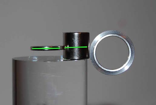 Below: Left is a 5/8” neodymium with a disk magnet in parallel to the 5/8” dielectric inertial plane, also a steel ring sitting perpendicular to the dielectric inertial plane. Middle picture, steel disk perpendicular to 