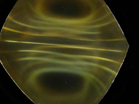 Below: Cube magnet under ferrocell. Polarity is left to right on left image, and top to bottom on right image. Notice the brighter yellow light along the inertial plane of the magnet.