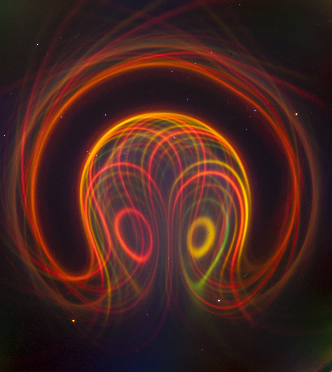 Below: [Photo courtesy of Michael Snyder of revolution-labs.com] Broken ring magnet illustrated by the Timm Vanderelli ferrocell. Notice the color displacements. The red exists along the center where there is lower diele