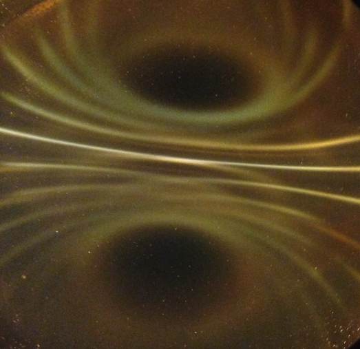 Below: Three images of cube 1” magnets under the ferrocell. Notice the bright white light along the inertial plane on the images, especially on the far right.