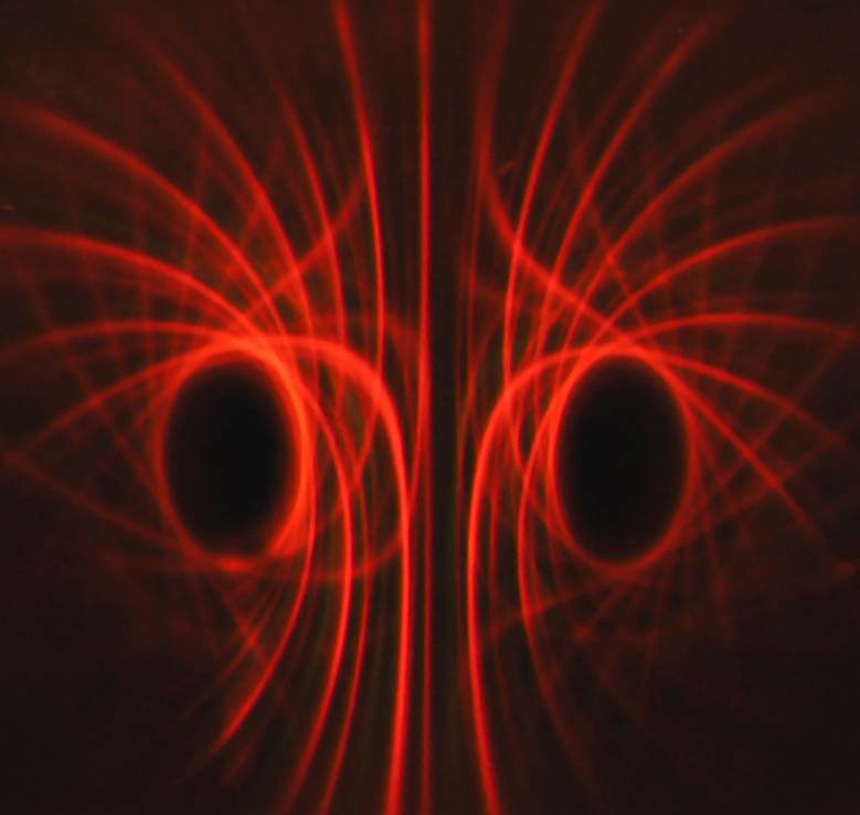 Below: [Photo courtesy of Michael Snyder of revolution-labs.com]. On left ring magnet showing hypotrochoid center; notice the higher dielectric capacitance light is on the periphery and the low dielectric capacitance red