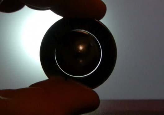 Below: 3/4” sphere neodymium and disk magnet sitting in perfect pressure mediation along their mutual dielectric inertial planes. Likewise on right, showing phi^-2 contact as necessitated by gyromagnetic precession.