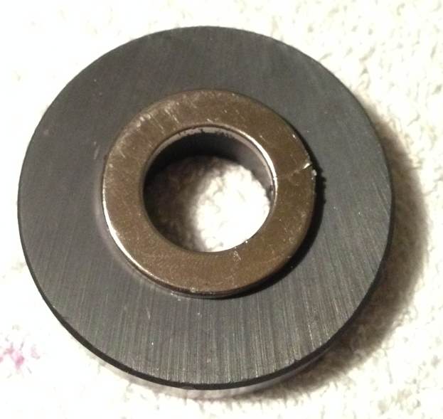 Below: Large ceramic magnet with neodymium magnet attached. On right showing both together under the ferrocell. With field pressures equalized both magnets appear no different than a single ring magnet.