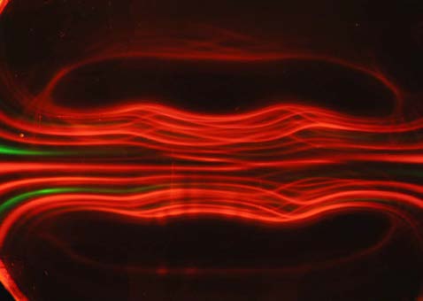 Below: [Photo courtesy of Michael Snyder of revolution-labs.com]. On the left are 3 magnets, some undergoing voidance, and the far left and right undergoing counter-voidance (repulsion). On the right is light being direc