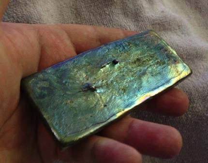 Below: Left is a 1-pound ingot of pure 99.99% bismuth. On right is a two-piece cast experiment in pure bismuth. There is a ‘secret’ in the picture on the right that is wholly unrelated to the flash angle of the photograp