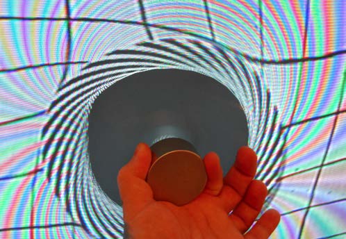 Below: Both images below are the exact same clockwise spiral from the testing pattern on the wall, but the left shows a torus formation proving the centrifugal magnetism on this side of the magnet is CCW, and exactly inv