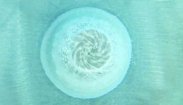 Below: Another youtube user showing hydrogen bubbles forming a vortex over the pole of a neodymium while undergoing electrolysis.