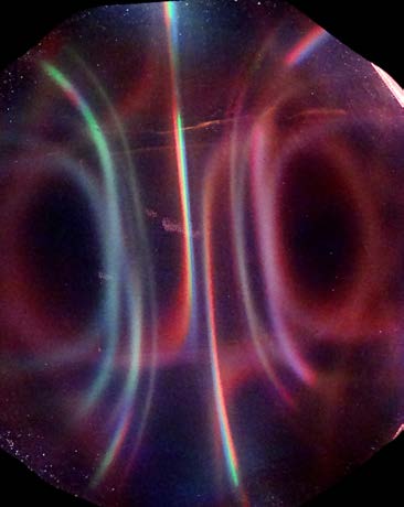 Below: As predicted and discovered by myself there is white light along the dielectric inertial plane of a N50 1” cube neodymium (any magnet as a matter of fact) and red and green light along the poles due their lower di