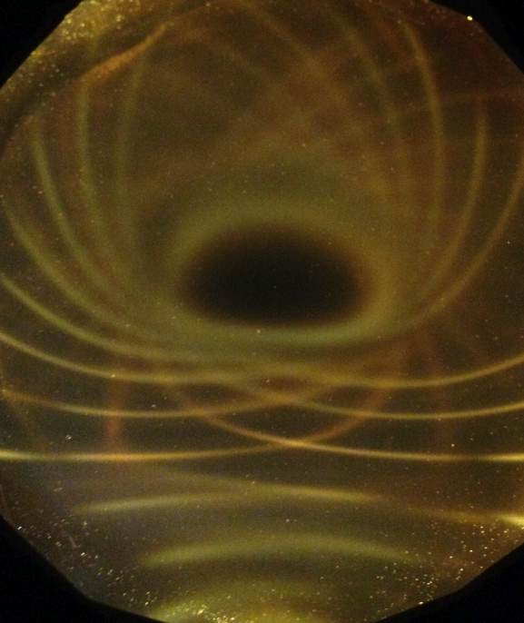 Below: Showing the holographic depth of the ferrocell looking at a steep angle along the pole of a cube magnet. Cube magnet, or round magnet makes no difference, field pressure is field pressure, the formations are ident