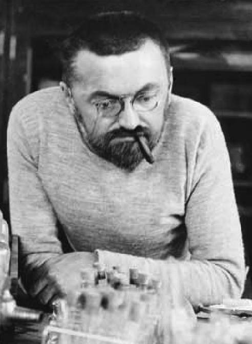 Black-and-white portrait of Charles Proteus Steinmetz leaning over laboratory equipment.