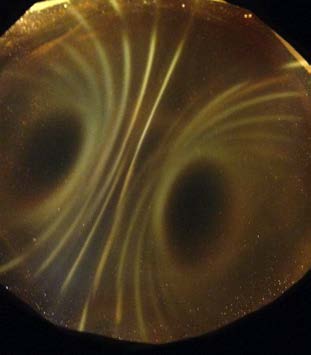Below: Three images of cube 1” magnets under the ferrocell. Notice the bright white light along the inertial plane on the images, especially on the far right.