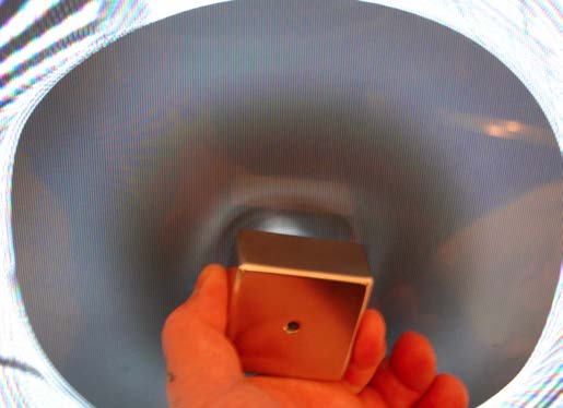 Below: Alternating rings of cloudy light and dark as necessitated by dielectric displacement from the centrifugal magnetism as against the CRT.
