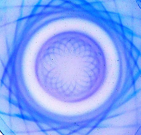 Below: Two color inverted images of ring magnets under the ferrocell. Notice the perfect pair of inner and outer hypotrochoid of convergence and divergence.
