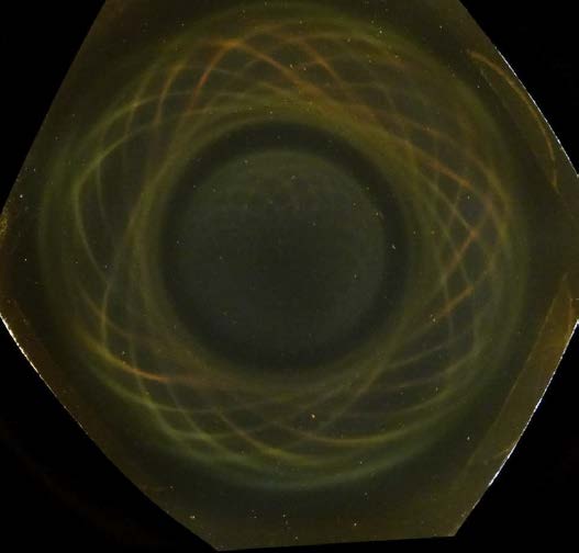 Below: Large ceramic ring magnet on left showing the pair of hypotrochoids. Notice the depth of holographic effect as seen in the sphere on the left at the center of the ring magnet. Closing dielectric voidances are nece
